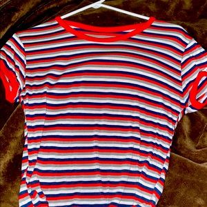 A cropped red, blue, grey, and white shirt.